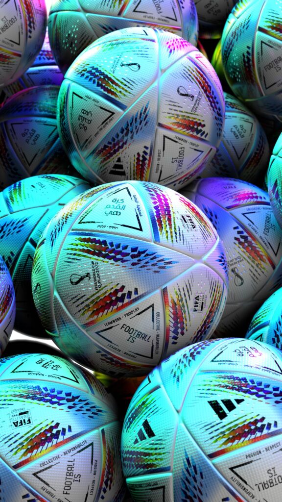 現在の画像: Eye-catching display of vibrant FIFA World Cup soccer balls, highlighting sports equipment details.